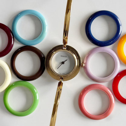 Gucci 1990s Interchangeable Bezel Gold Plated Bangle Watch with 12 bezels, case