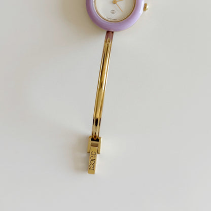 Gucci 1990s Interchangeable Bezel Gold Plated Bangle Watch with 12 bezels, case