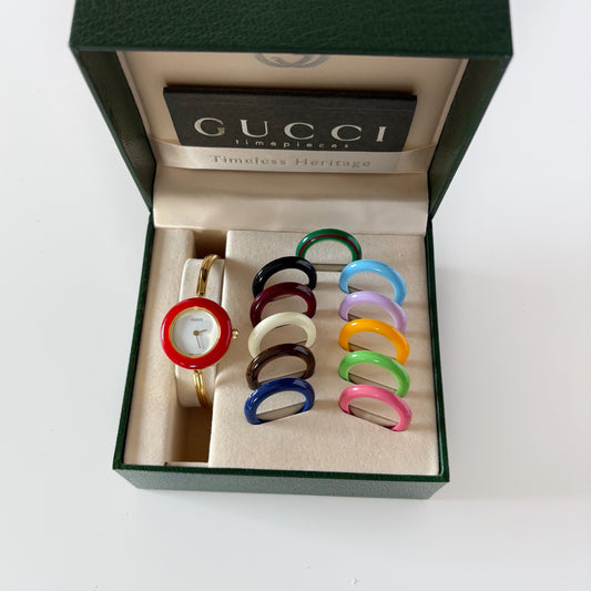 Gucci 1990s Interchangeable Bezel Gold Plated Bangle Watch with 12 bezels, case