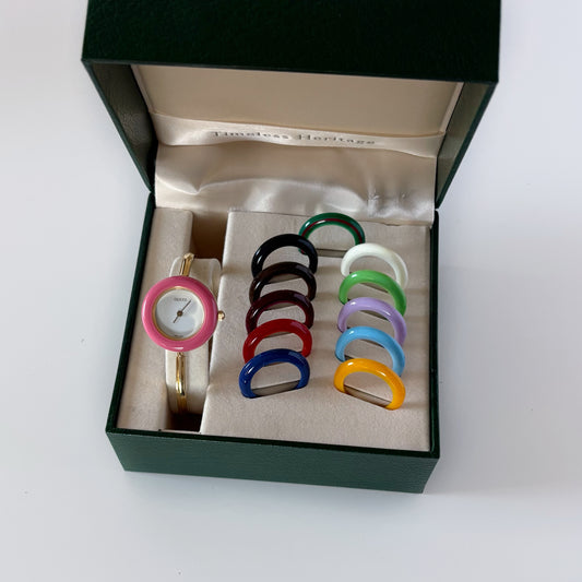 Gucci 1990s Interchangeable Bezel Gold Plated Bangle Watch with 12 bezels, case
