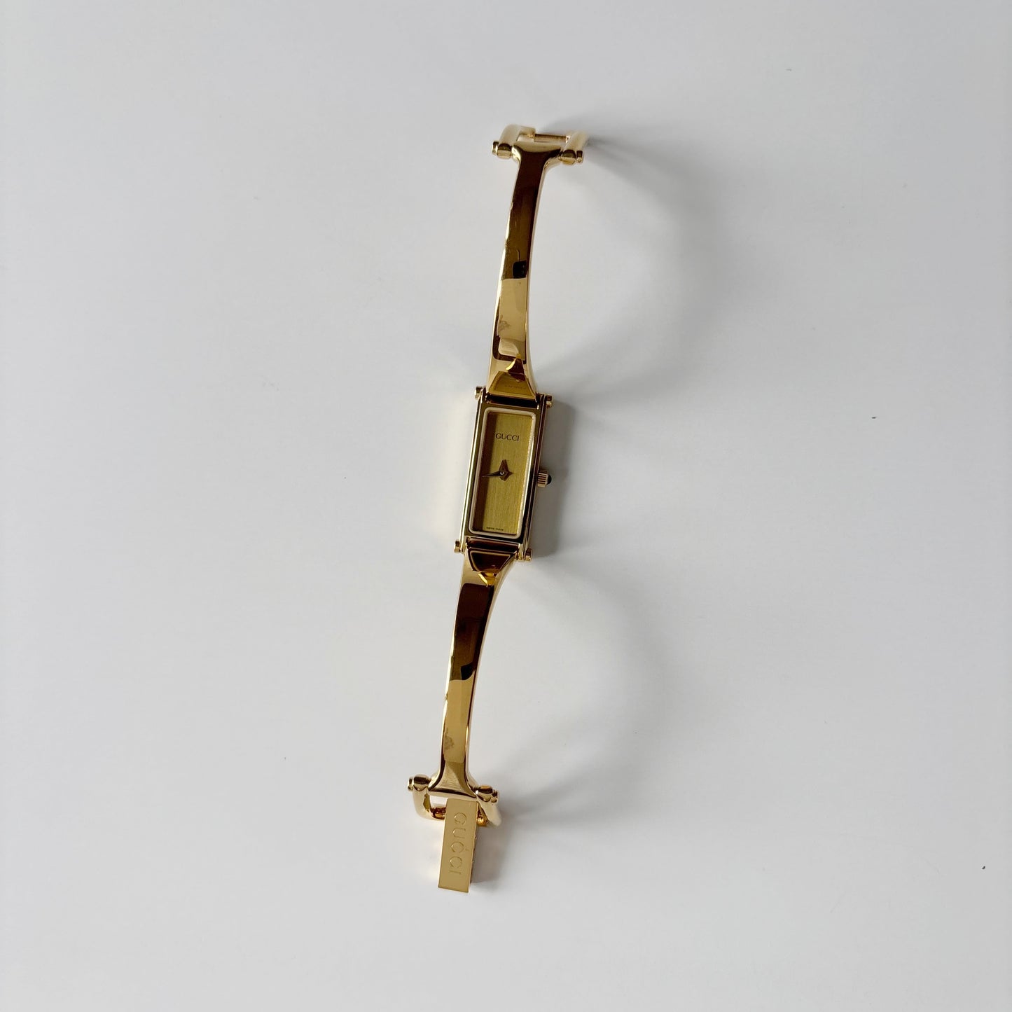 Gucci 1990s Gold Rectangular Dial Gold Plated Bangle Watch