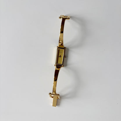 Gucci 1990s Gold Rectangular Dial Gold Plated Bangle Watch