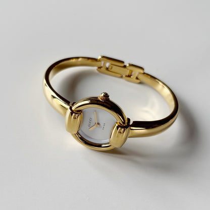 Gucci 1990s Round Dial Gold Plated Bangle Watch
