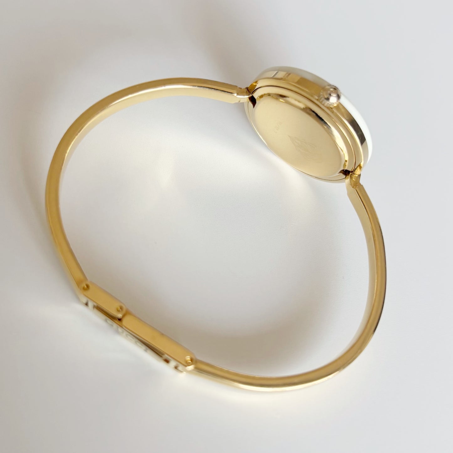 Gucci 1990s Interchangeable Bezel Gold Plated Bangle Watch with 12 bezels, case