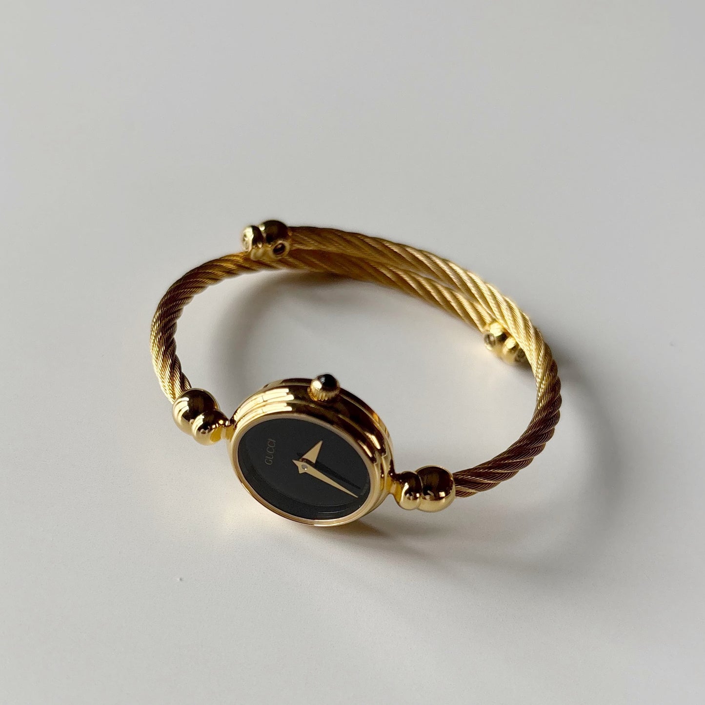 Gucci 1990s Black Dial Gold Plated Cable Bangle Watch