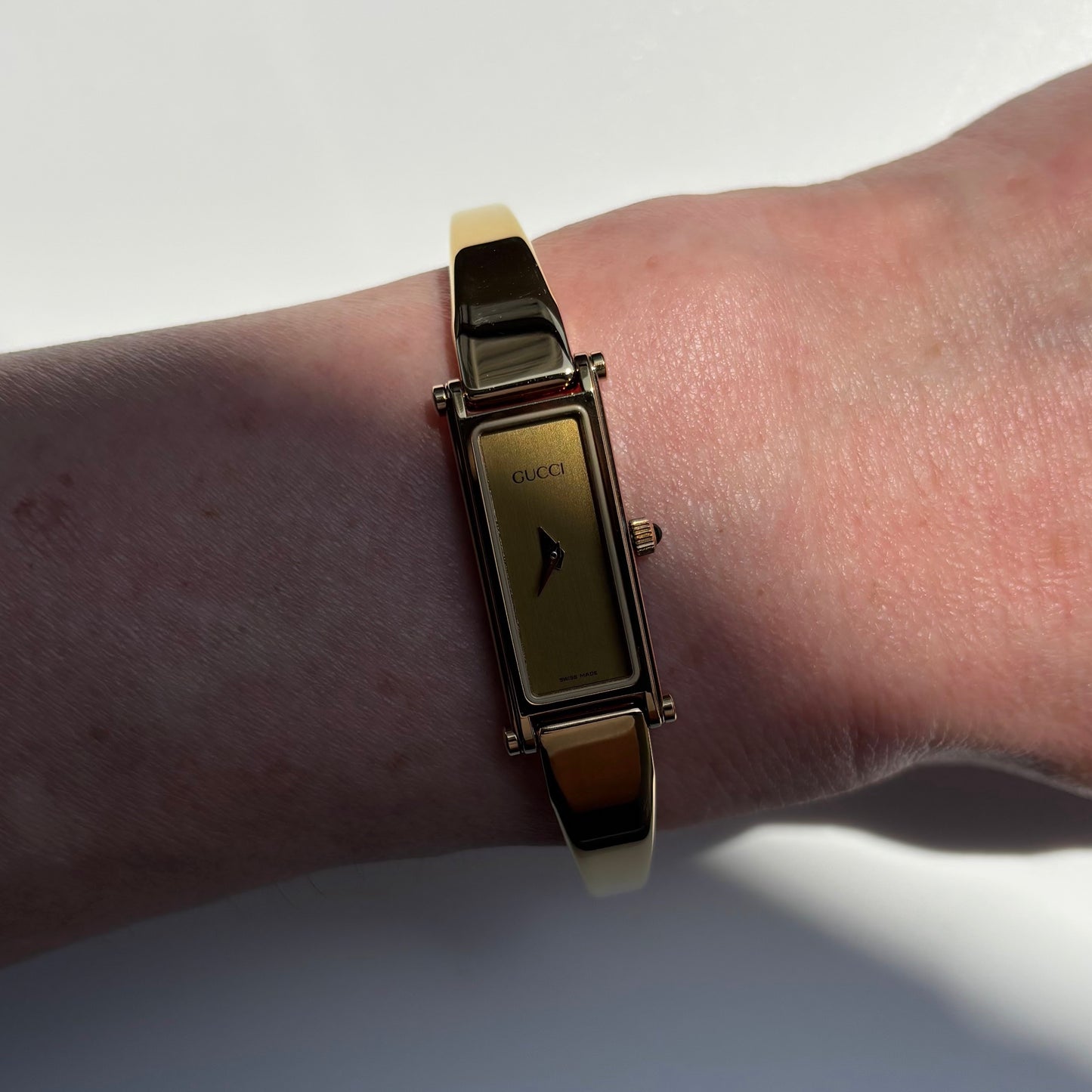 Gucci 1990s Gold Rectangular Dial Gold Plated Bangle Watch