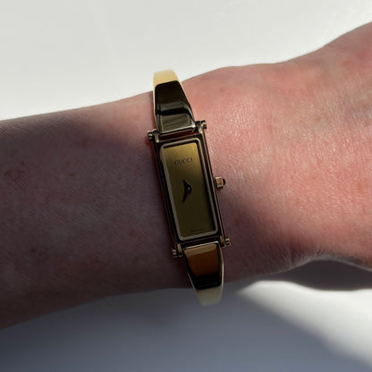 Gucci 1990s Gold Rectangular Dial Gold Plated Bangle Watch
