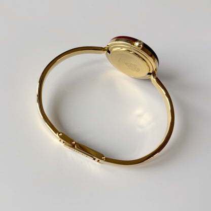 Gucci 1990s Interchangeable Bezel Gold Plated Bangle Watch with 12 bezels, case
