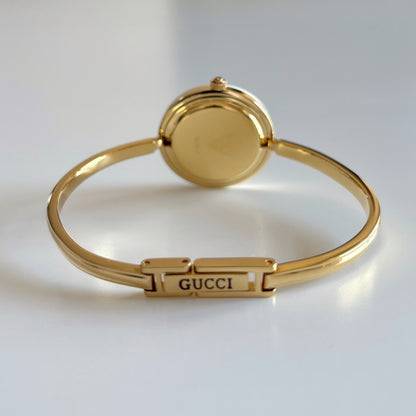 Gucci 1990s Interchangeable Bezel Gold Plated Bangle Watch with 12 bezels, case