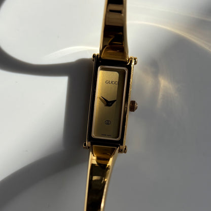 Gucci 1990s Gold Rectangular Dial Gold Plated Bangle Watch