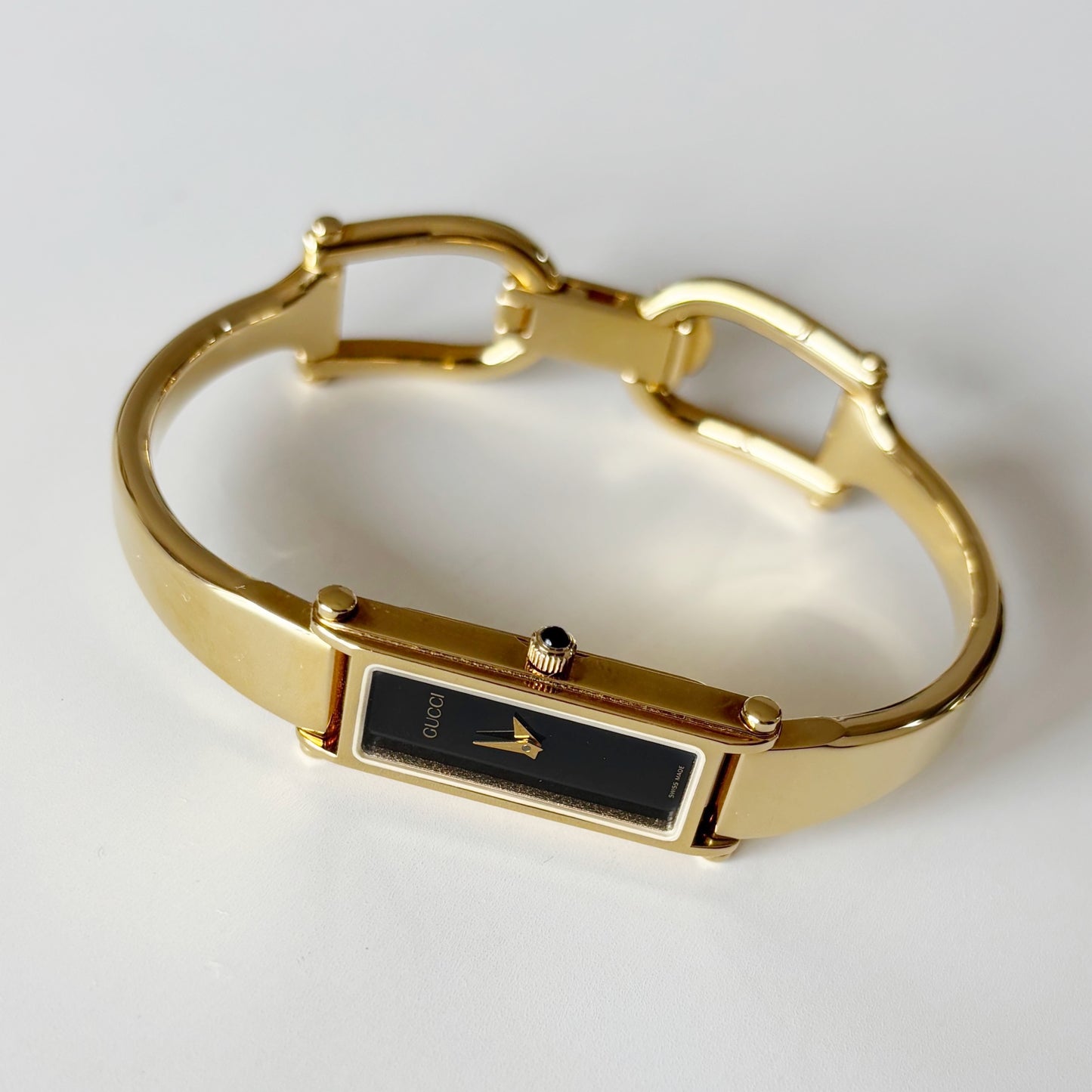 Gucci 1990s Rectangular Black Dial Gold Plated Bangle Watch