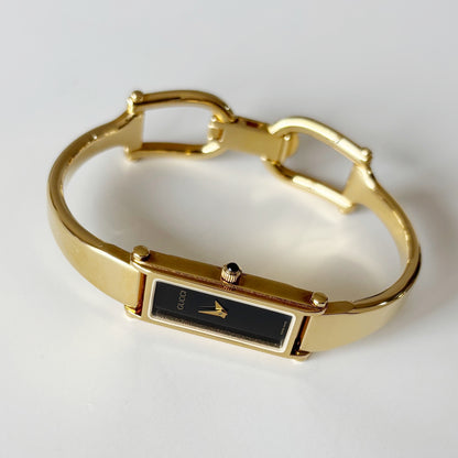 Gucci 1990s Rectangular Black Dial Gold Plated Bangle Watch