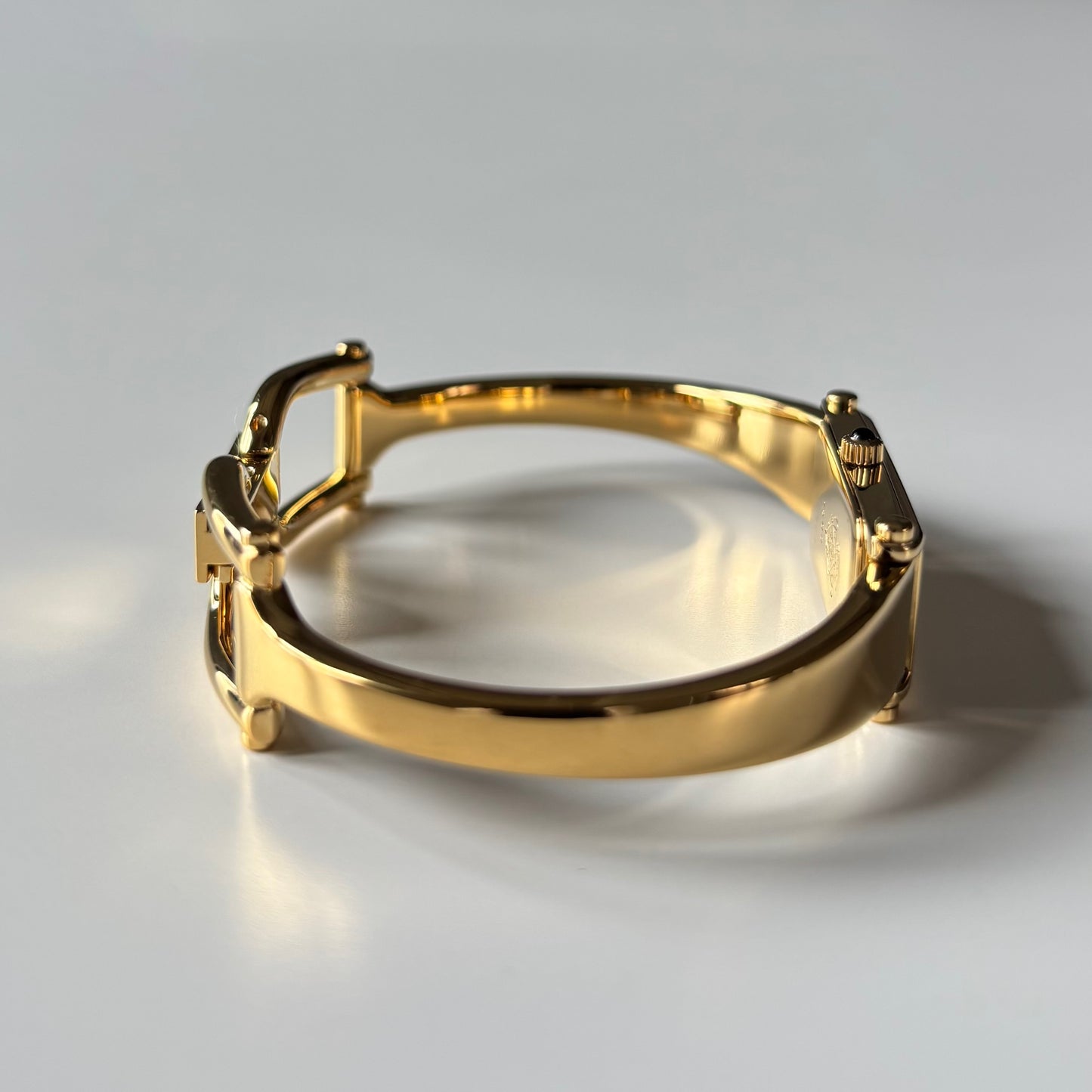 Gucci 1990s Gold Rectangular Dial Gold Plated Bangle Watch