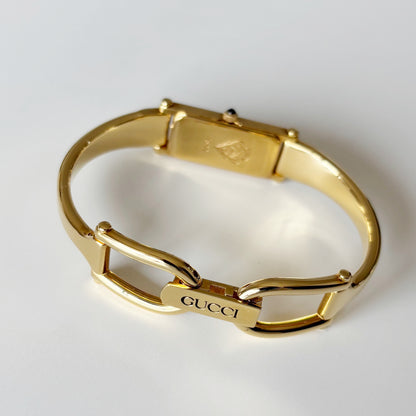 Gucci 1990s Rectangular Black Dial Gold Plated Bangle Watch