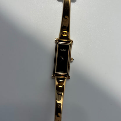 Gucci 1990s Black Rectangular Dial Gold Plated Bangle Watch
