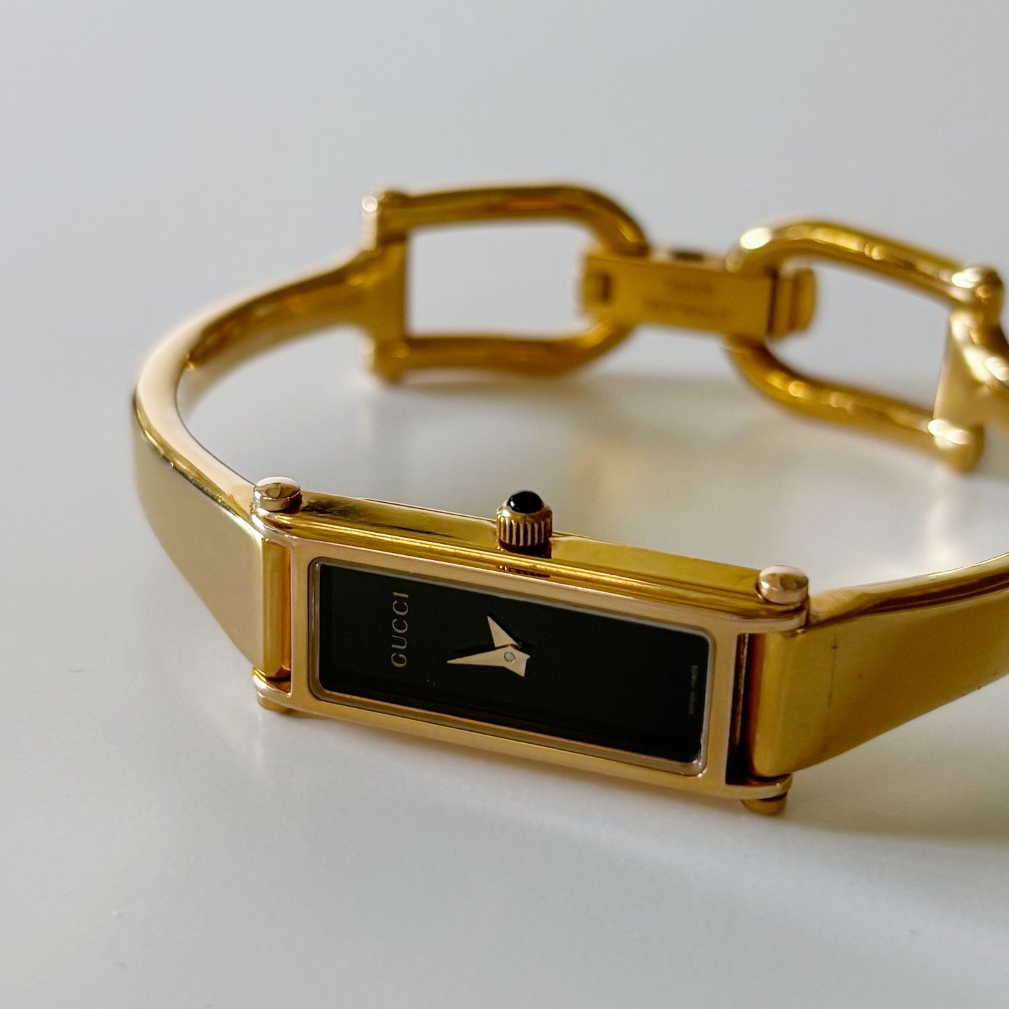 Gucci 1990s Rectangular Black Dial Gold Plated Bangle Watch