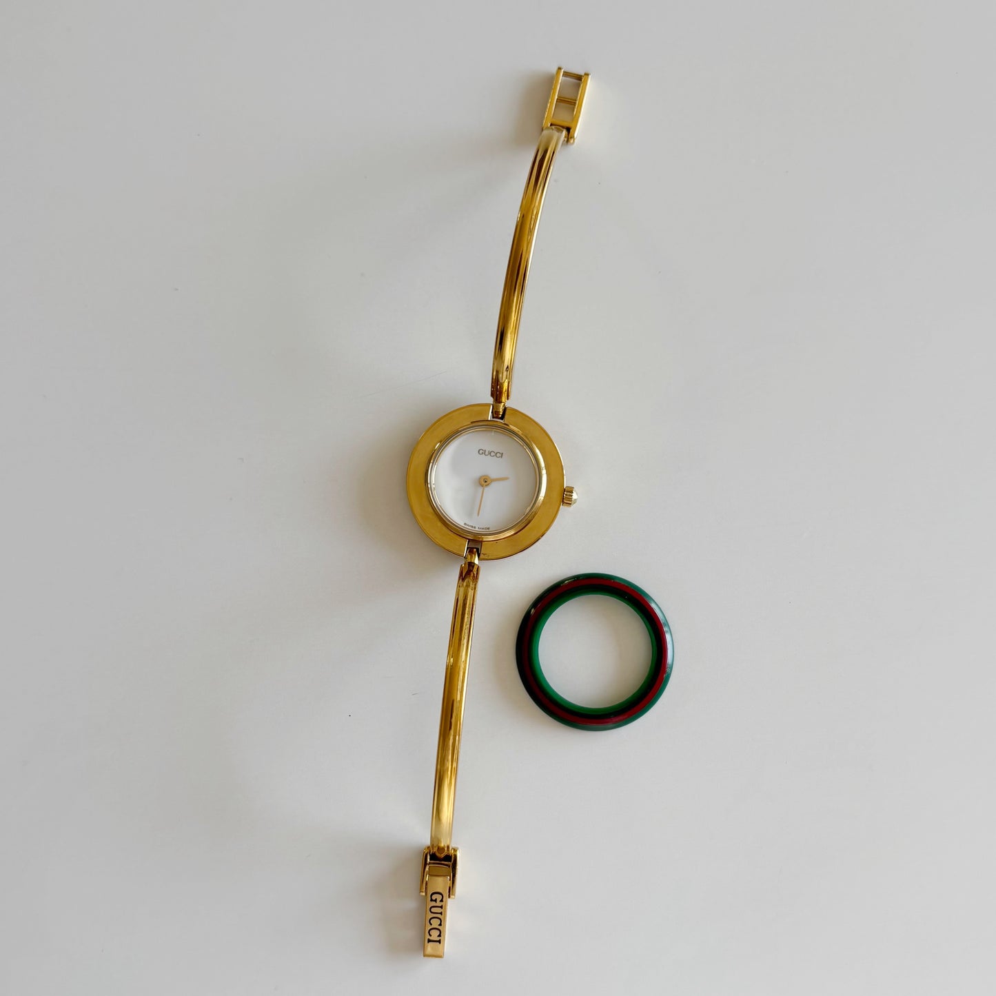 Gucci 1990s Interchangeable Bezel Gold Plated Bangle Watch with 12 bezels, case
