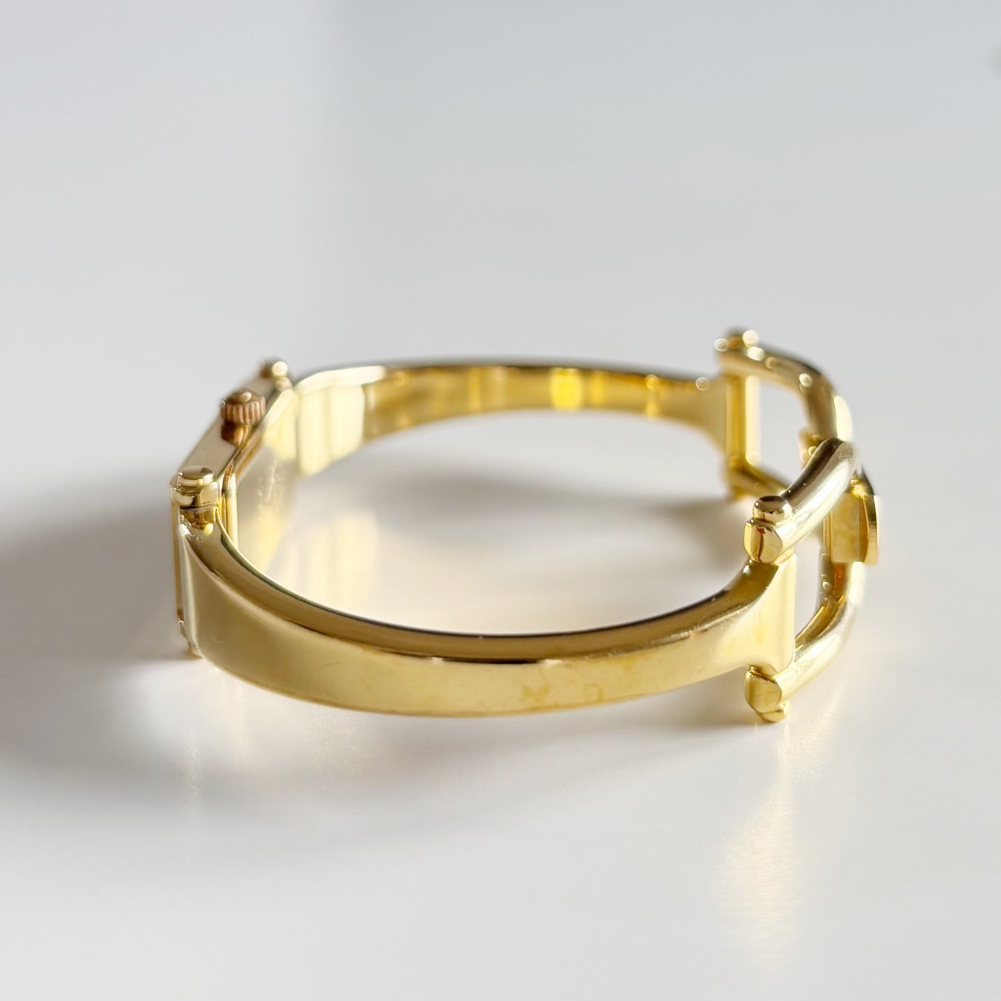 Gucci 1990s Gold Rectangular Dial Gold Plated Bangle Watch