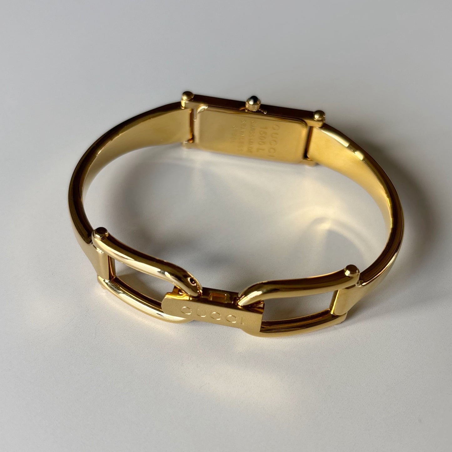 Gucci 1990s Black Rectangular Dial Gold Plated Bangle Watch