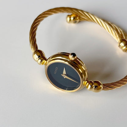 Gucci 1990s Black Dial Gold Plated Cable Bangle Watch