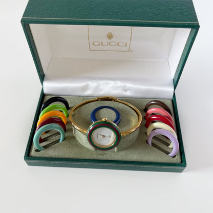Gucci 1990s Interchangeable Bezel Gold Plated Bangle Watch with 12 bezels, case