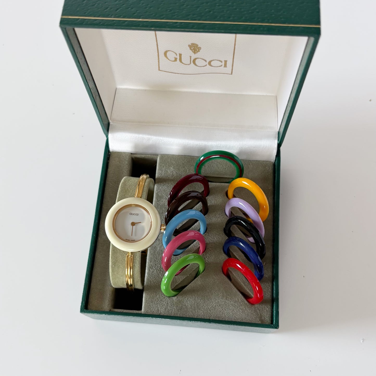 Gucci 1990s Interchangeable Bezel Gold Plated Bangle Watch with 12 bezels, case