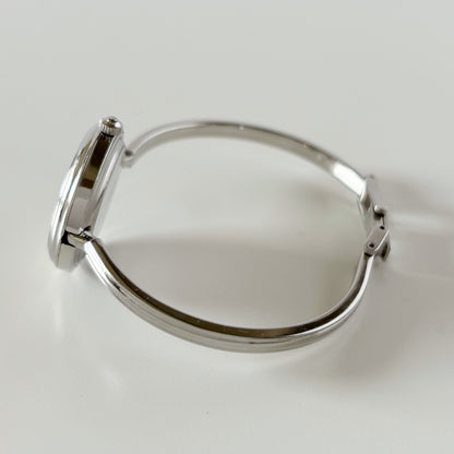 Gucci 1990s Interchangeable Bezel Stainless steel Bangle Watch with 12 bezels, case