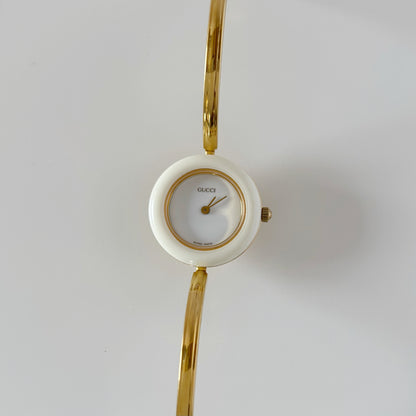 Gucci 1990s Interchangeable Bezel Gold Plated Bangle Watch with 12 bezels, case