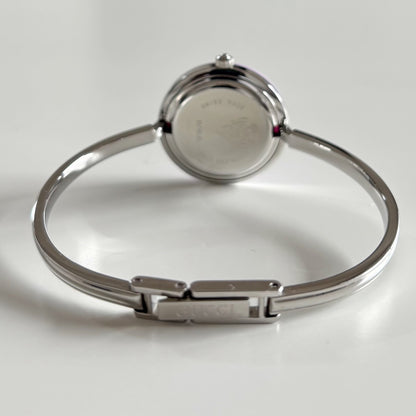 Gucci 1990s Interchangeable Bezel Stainless Steel Bangle Watch with 12 bezels, case