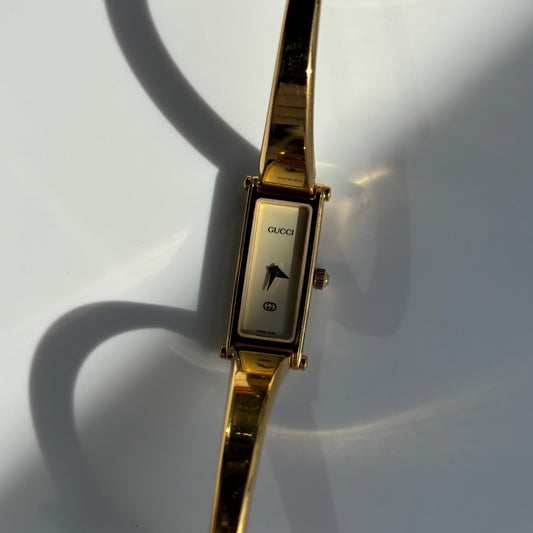 Gucci 1990s Rectangular Dial Gold Plated Bangle Watch