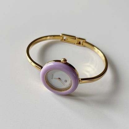 Gucci 1990s Interchangeable Bezel Gold Plated Bangle Watch with 12 bezels, case