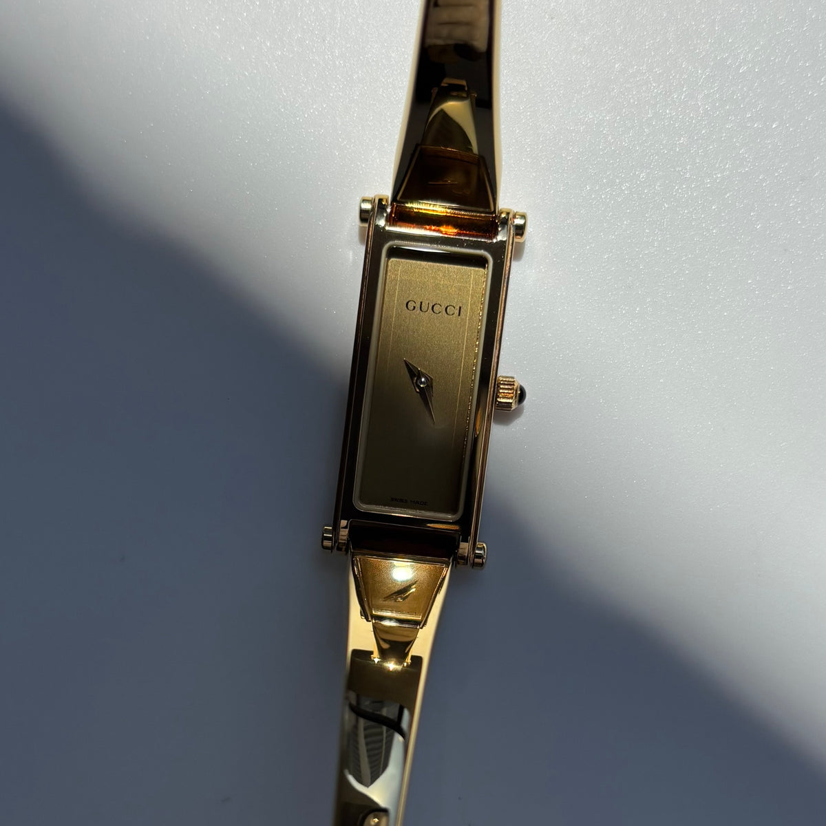Gucci 1990s Rectangular Gold Dial Gold-Plated Watch