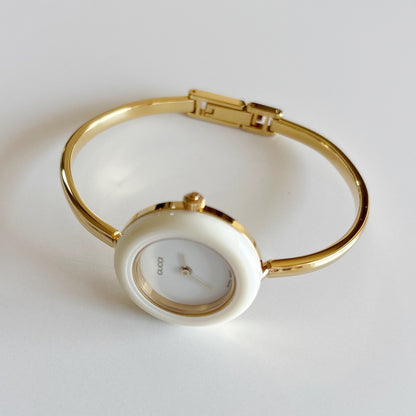 Gucci 1990s Interchangeable Bezel Gold Plated Bangle Watch with 12 bezels, case