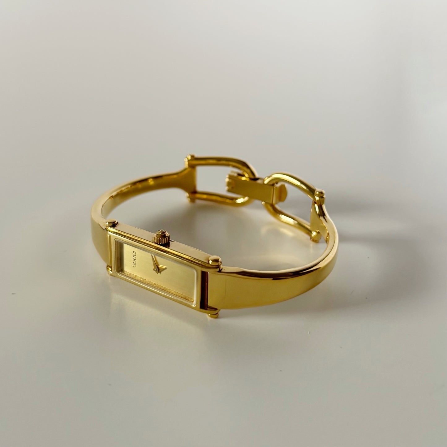 Gucci 1990s Gold Dial Rectangular Gold Plated Bangle Watch