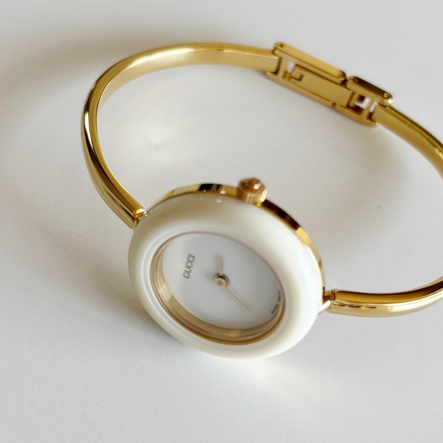Gucci 1990s Interchangeable Bezel Gold Plated Bangle Watch with 12 bezels, case