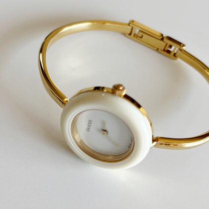 Gucci 1990s Interchangeable Bezel Gold Plated Bangle Watch with 12 bezels, case