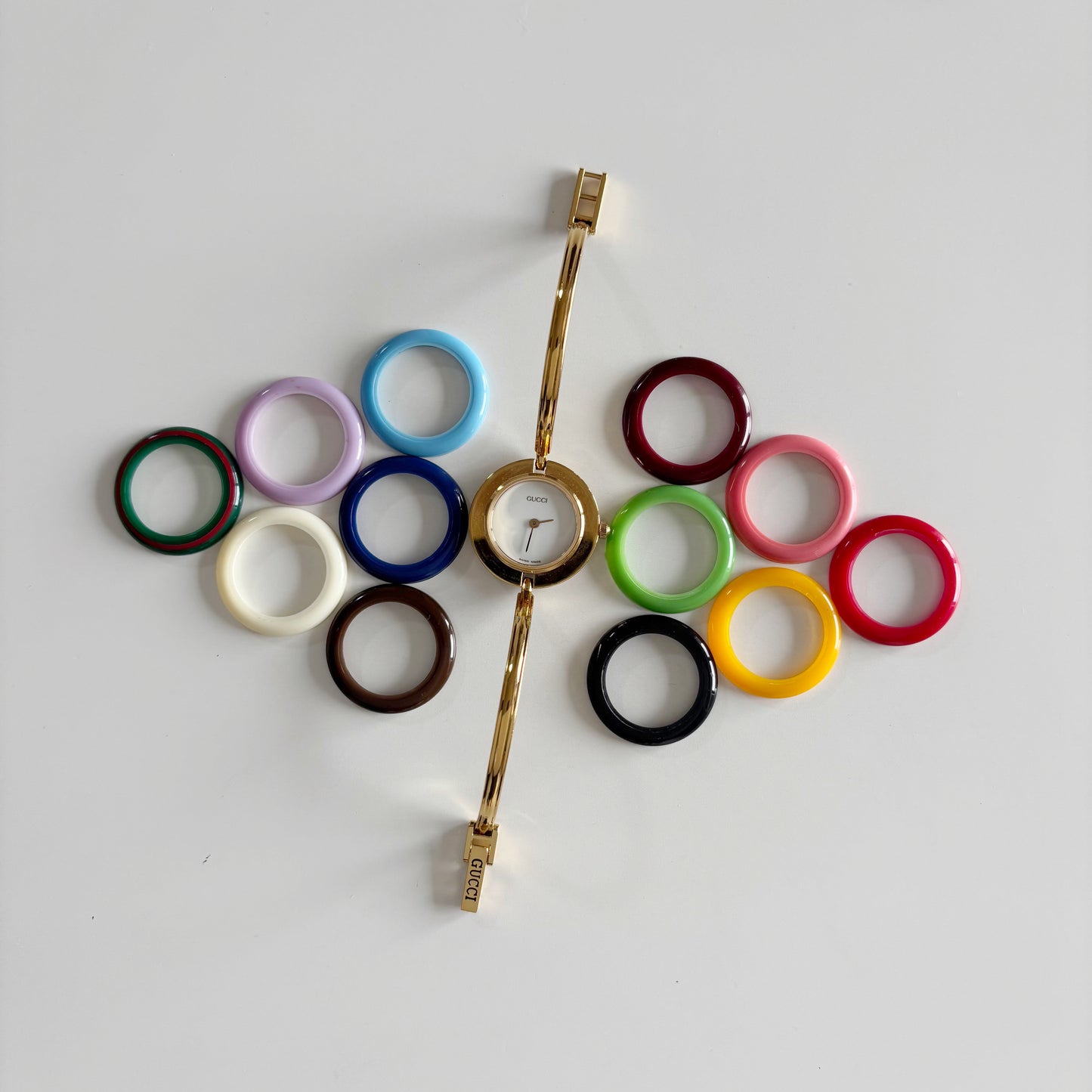 Gucci 1990s Interchangeable Bezel Gold Plated Bangle Watch with 12 bezels, case