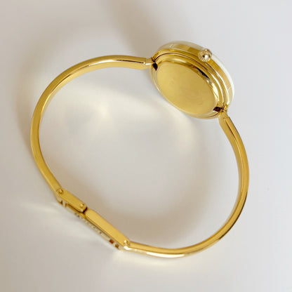 Gucci 1990s Interchangeable Bezel Gold Plated Bangle Watch with 12 bezels, case