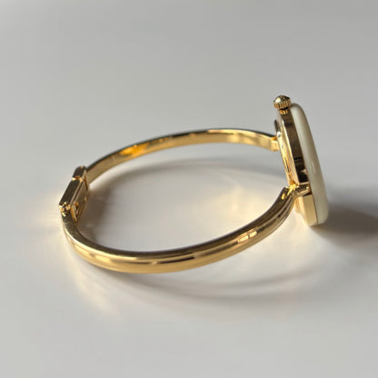 Gucci 1990s Interchangeable Bezel Gold Plated Bangle Watch with 12 bezels, case