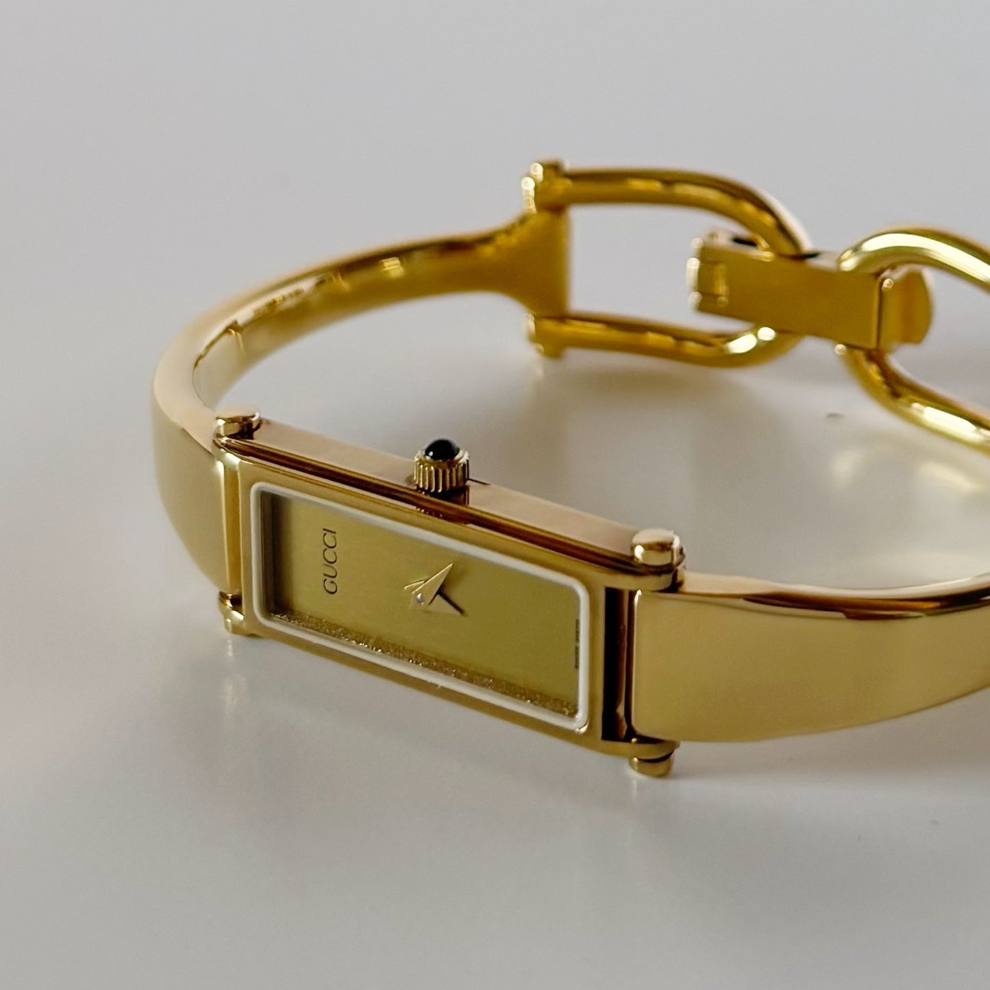 Gucci 1990s Gold Rectangular Dial Gold Plated Bangle Watch