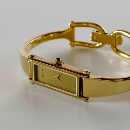 Gucci 1990s Gold Rectangular Dial Gold Plated Bangle Watch