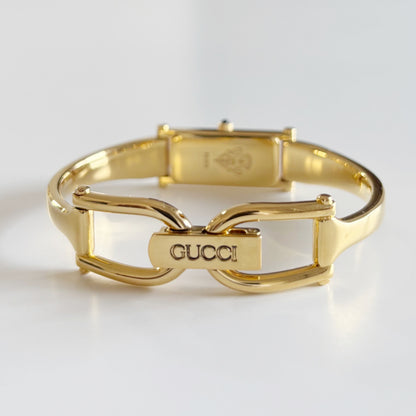 Gucci 1990s Black Dial Rectangular Gold Plated Bangle Watch