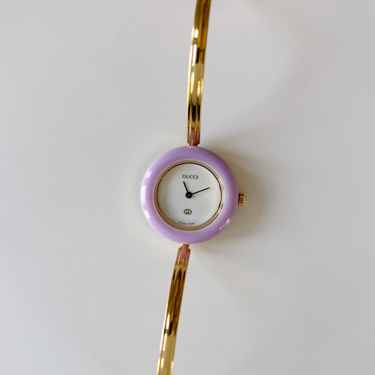 Gucci 1990s Interchangeable Bezel Gold Plated Bangle Watch with 12 bezels, case