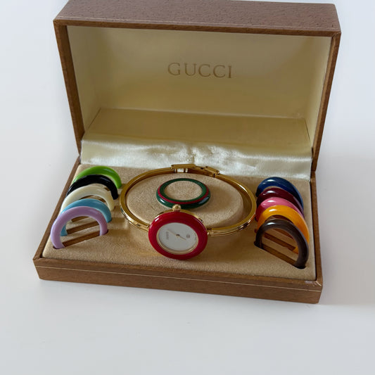 Gucci 1990s Interchangeable Bezel Gold Plated Bangle Watch with 12 bezels, case