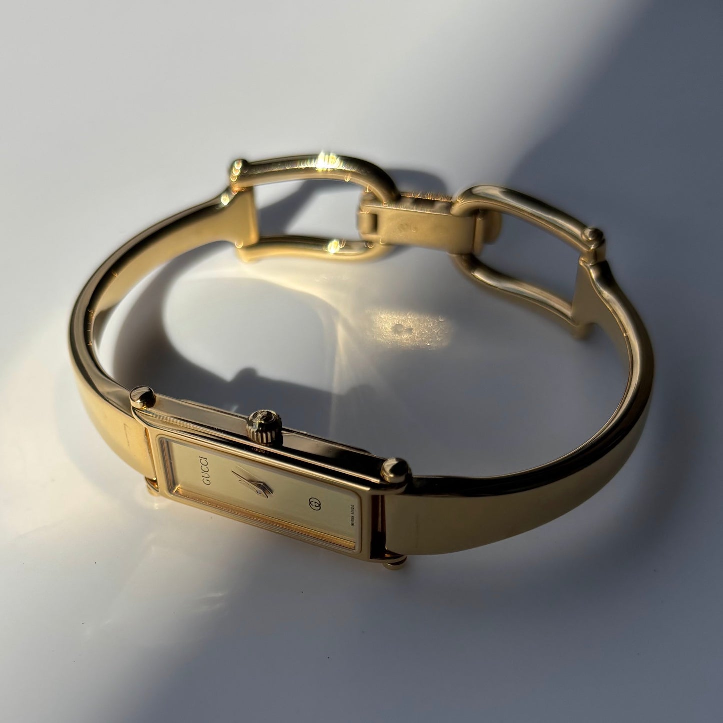 Gucci 1980s Rectangular Gold Dial Gold Plated Bangle Watch