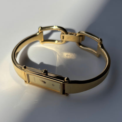 Gucci 1980s Rectangular Gold Dial Gold Plated Bangle Watch