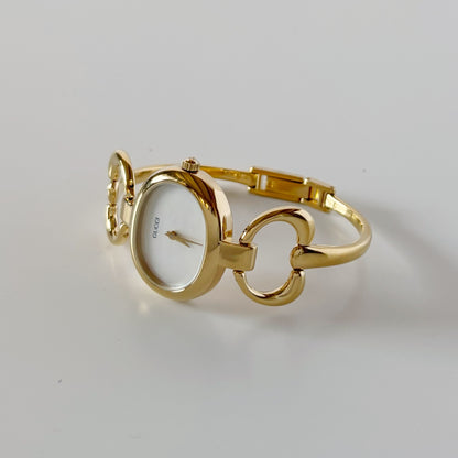 Gucci 1990s Seashell Oval Dial Gold-Plated Bangle Watch (Small)