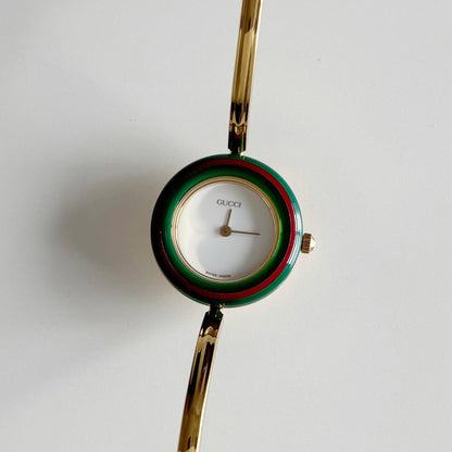 Gucci 1990s Interchangeable Bezel Gold Plated Bangle Watch with 12 bezels, case