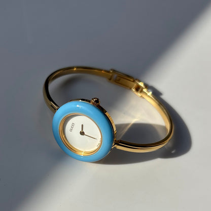 Gucci 1990s Interchangeable Bezel Gold Plated Bangle Watch with 12 bezels, case