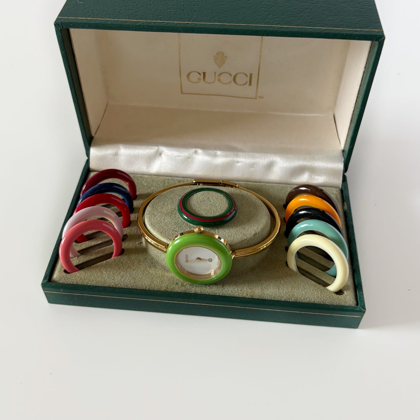 Gucci 1990s Interchangeable Bezel Gold Plated Bangle Watch with 12 bezels, case